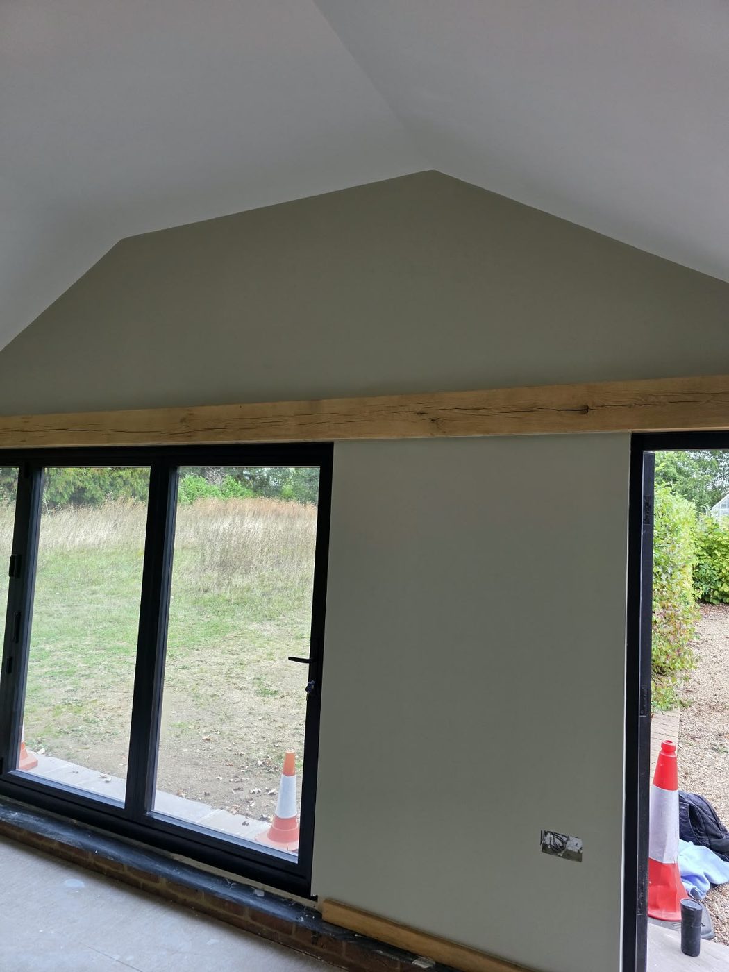 Oak lintel set above new aluminium doors in a house extension