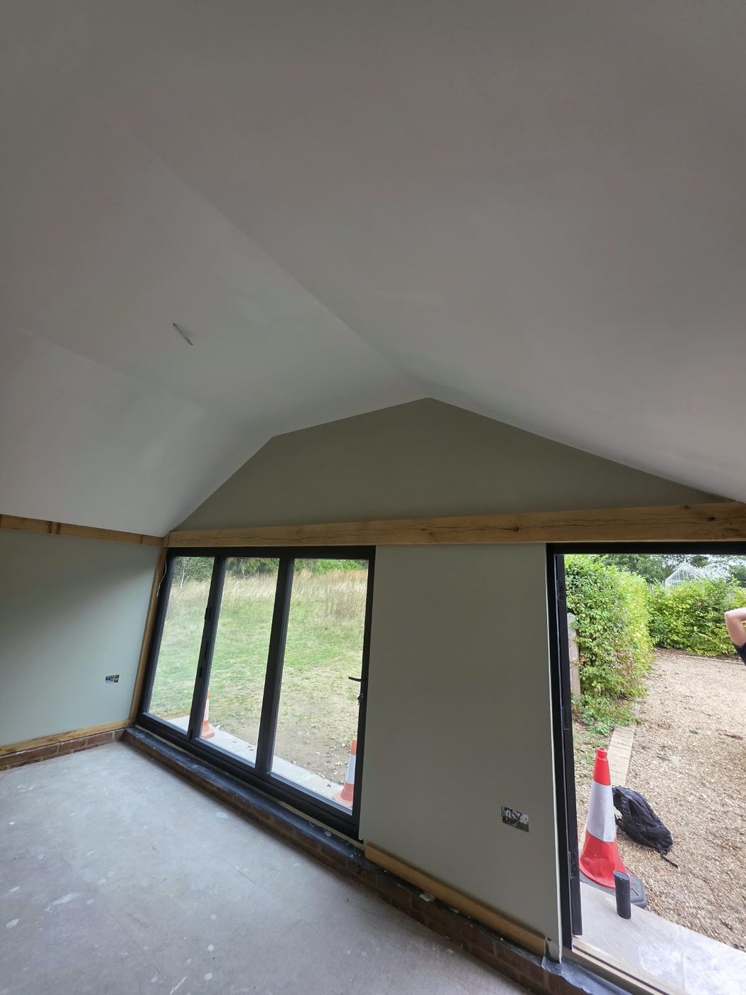 Vaulted garden room interior with full width sliding doors