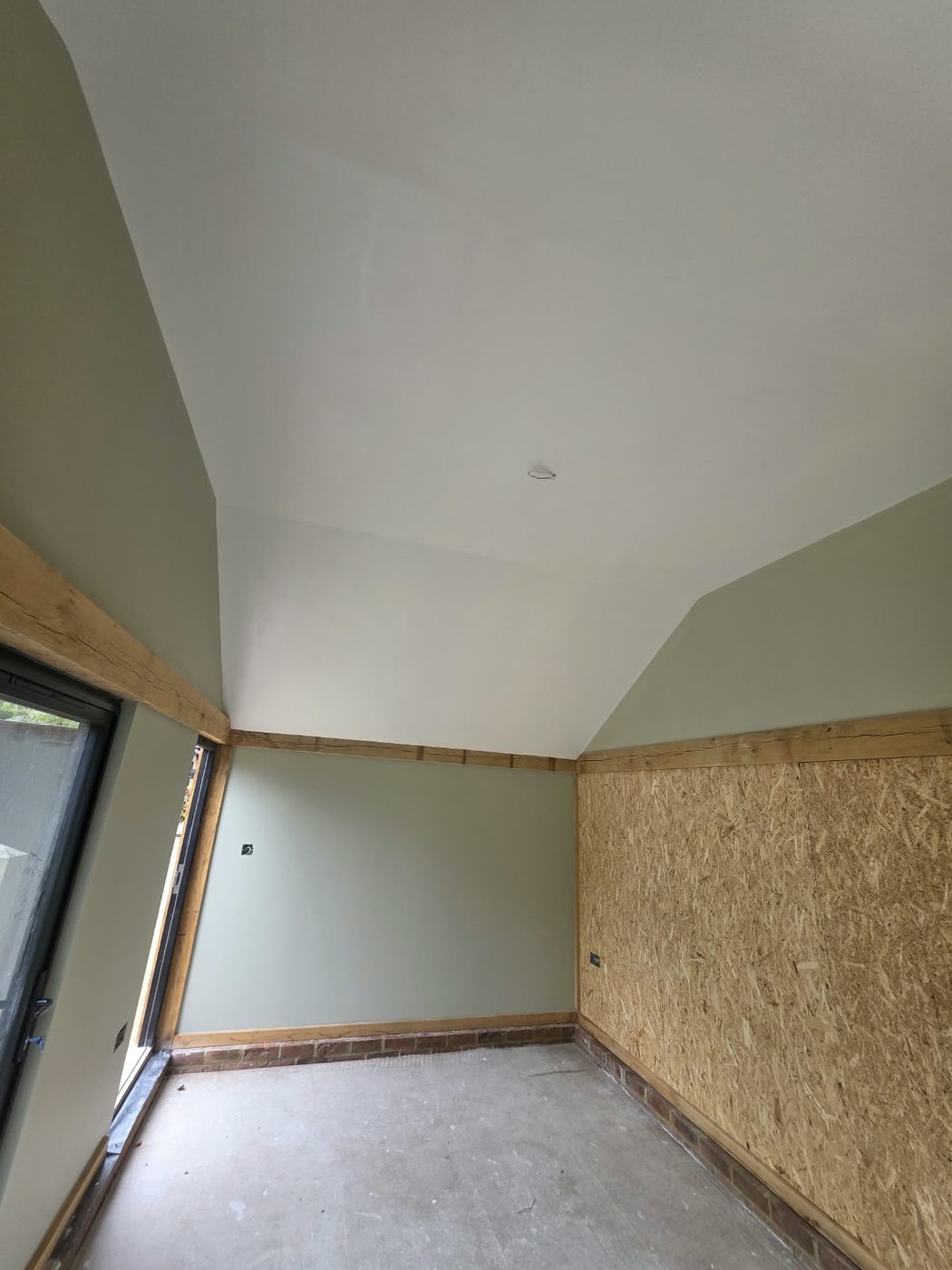 Oak frame interior with painted walls and exposed beams